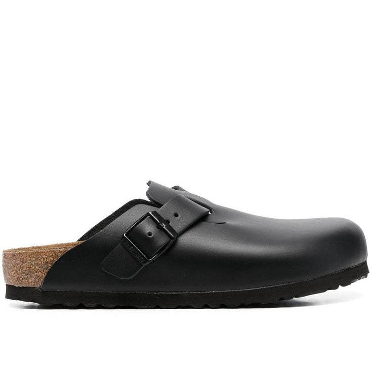 Black sandal with cork sole on a white background