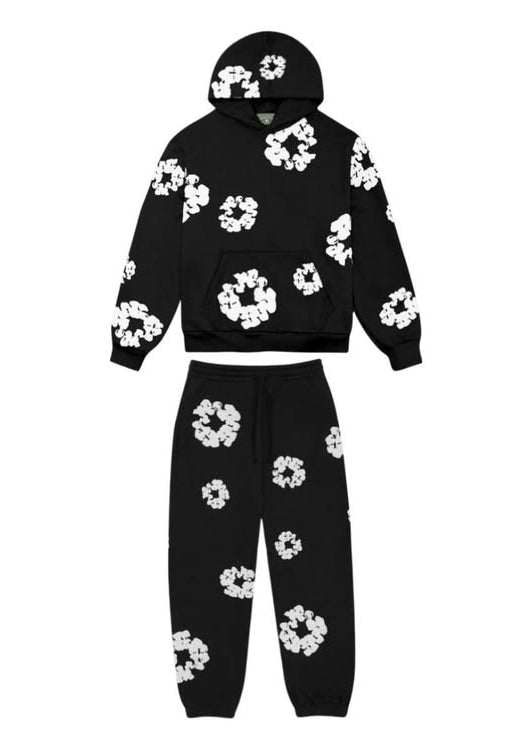 Black hoodie and sweatpants set with white floral patterns on a white background