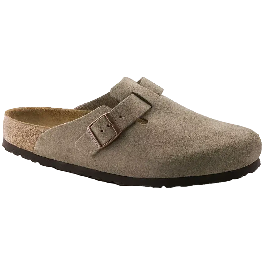 Brown suede clog shoe with a buckle on a white background